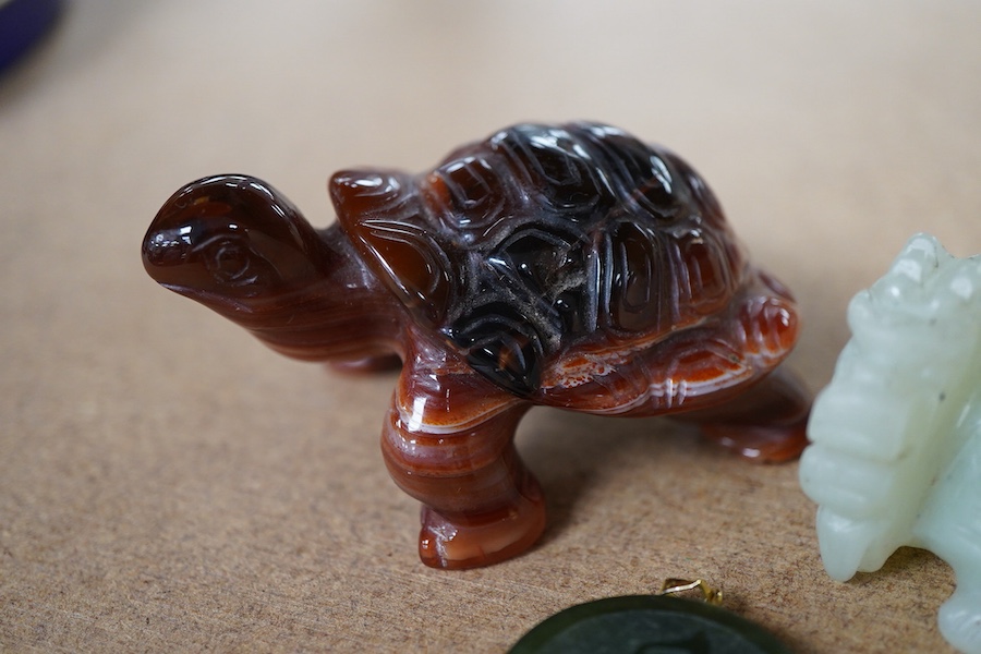 A Chinese carved jade pendant and two hardstone carved animals, pendant 3cm diameter.
